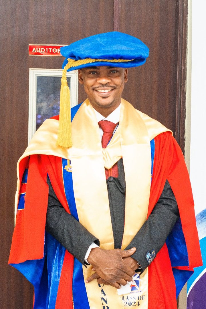 Dr. Amao in doctoral academic regalia at his 2024 graduation